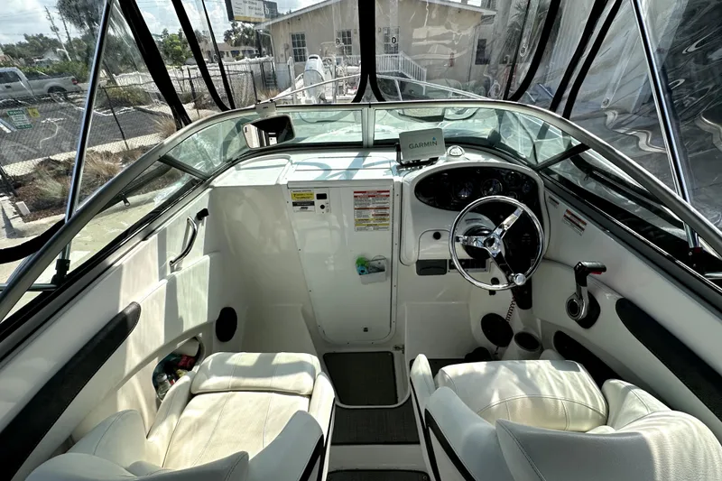 Slide: The Image of Interior view of 2021 Campion A21 boat cockpit with steering wheel and seating. - 8