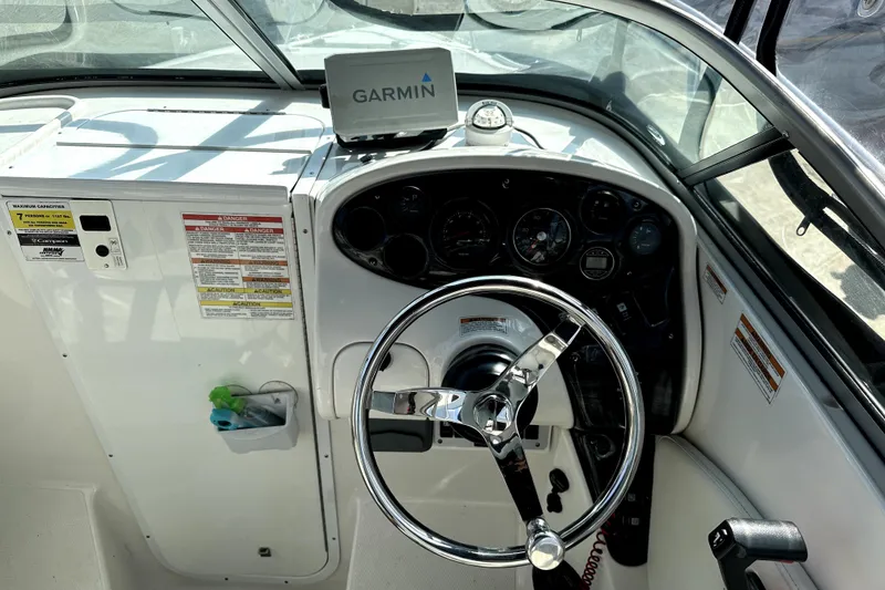 Slide: The Image of Cockpit of 2021 Campion A21 boat with Garmin navigation system and steering wheel. - 9