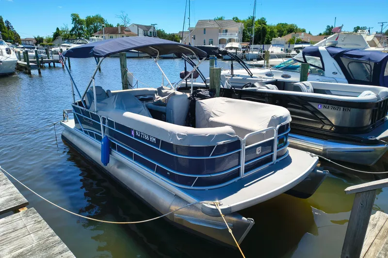 The Image of 2018 Godfrey Sweetwater 2286 C pontoon boat docked at marina. - 1