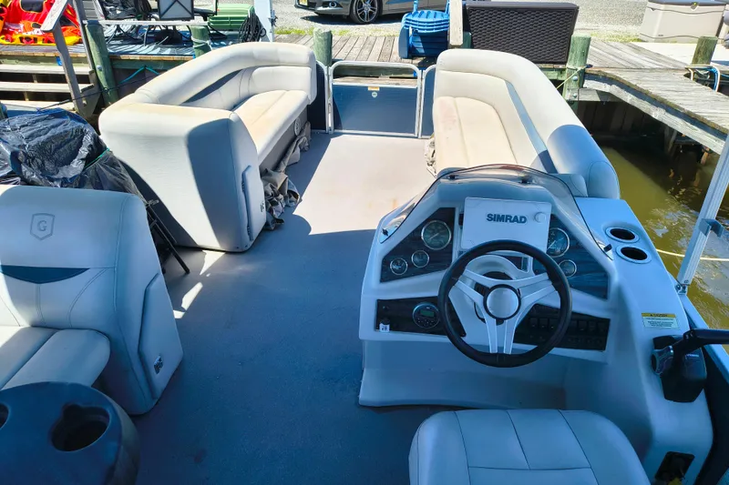 Slide: The Image of 2018 Godfrey Sweetwater 2286 C pontoon boat interior with helm and seating. - 5