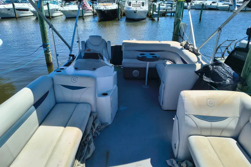 Slide: The Image of Interior of a 2018 Godfrey Sweetwater 2286 C pontoon boat at a marina. - 6