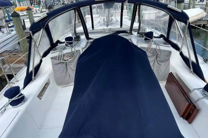Slide: The Image of Cockpit of a 2001 Catalina 34 MkII sailboat with navy covers and storage pockets. - 7