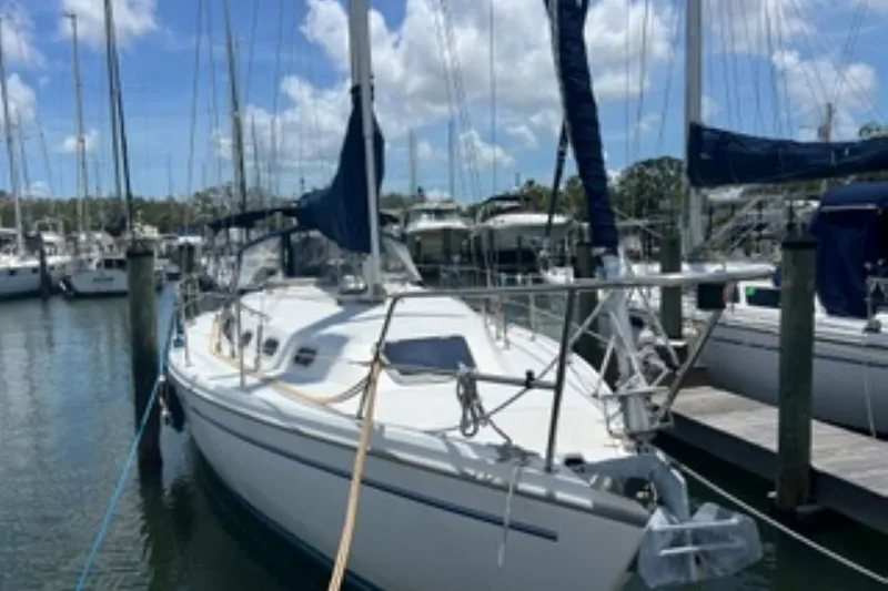 Slide: The Image of 2001 Catalina 34 MkII sailboat docked in a marina under a clear blue sky. - 3