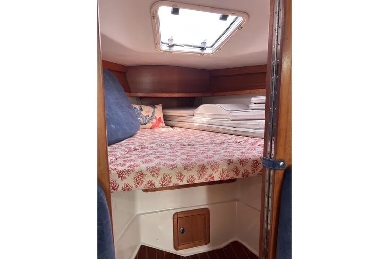 Slide: The Image of Cozy cabin interior of 2001 Catalina 34 MkII sailboat with patterned bedding. - 21