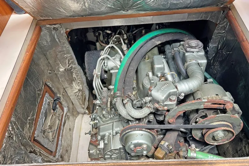 Slide: The Image of Engine compartment of a 2001 Catalina 34 MkII sailboat, showing detailed mechanical components. - 23