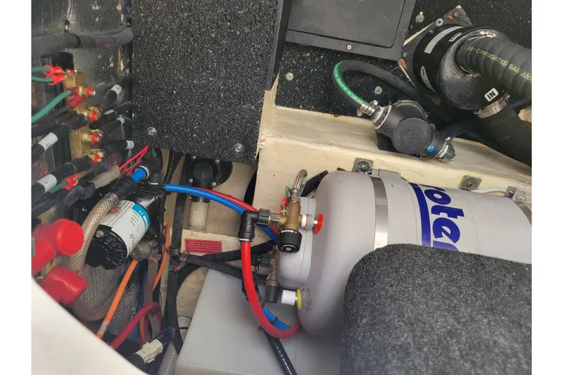 Slide: The Image of Engine compartment of 2023 Regal 26 XO boat with various mechanical components. - 10
