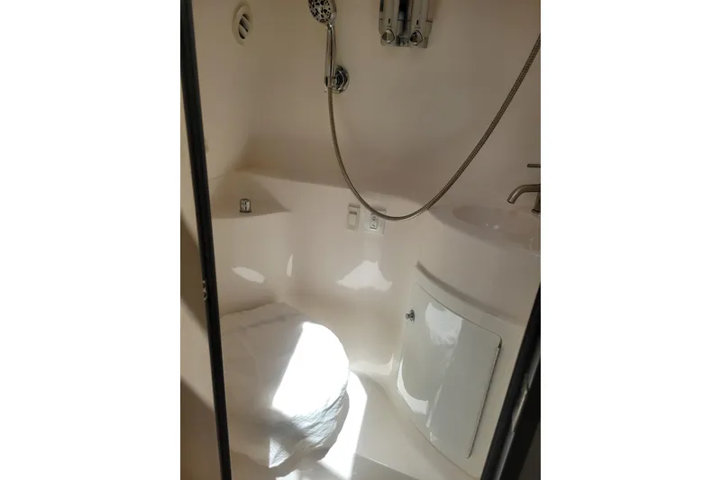 Slide: The Image of 2023 Regal 26 XO boat bathroom with shower and sink. - 19