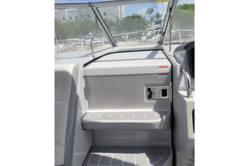 Slide: The Image of 2023 Regal 26 XO boat interior with sleek seating and modern design. - 5