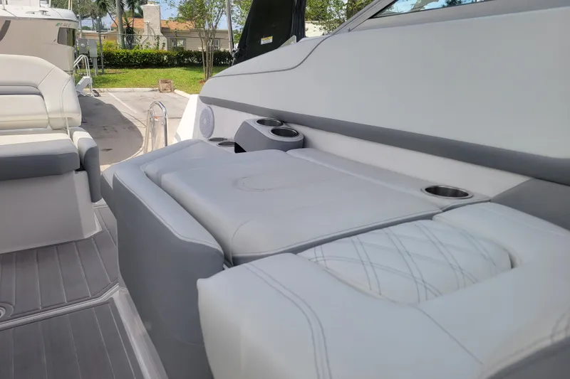 Slide: The Image of 2023 Regal 26 XO boat interior with luxurious seating and cup holders. - 6