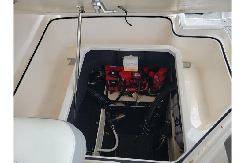 Slide: The Image of Engine compartment of a 2023 Regal 26 XO boat, showcasing mechanical components. - 7