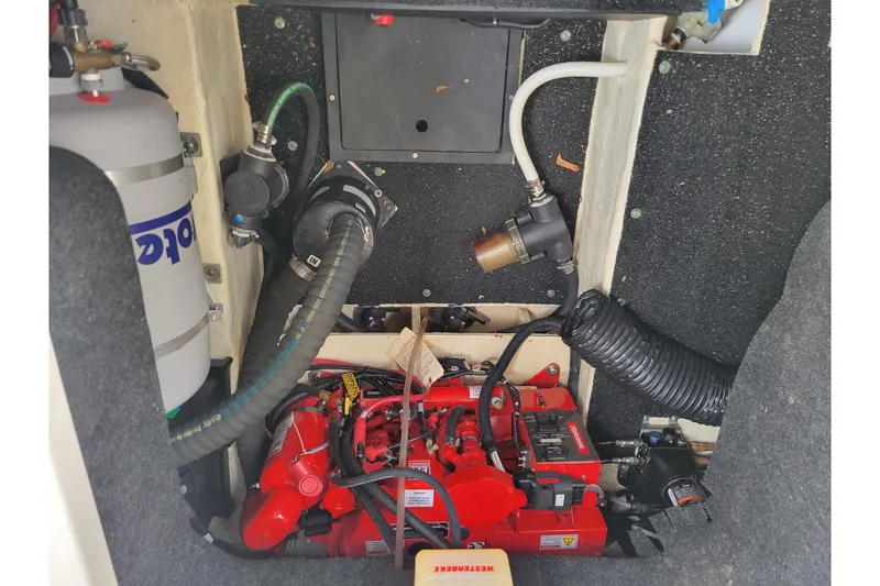 Slide: The Image of Engine compartment of 2023 Regal 26 XO boat, showcasing mechanical components and wiring. - 8