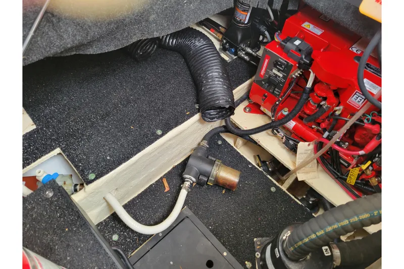 Slide: The Image of Engine compartment of 2023 Regal 26 XO boat with visible wiring and components. - 9