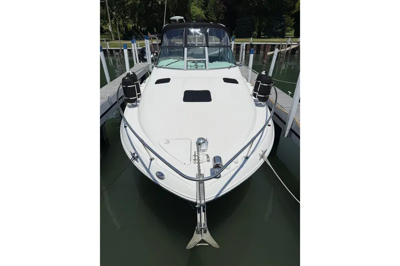Slide: The Image of 1999 Sea Ray Sundancer 310 docked at marina, front view. - 2