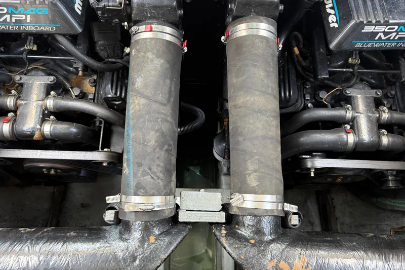 Slide: The Image of Twin MerCruiser engines in a 1999 Sea Ray Sundancer 310 boat. - 28