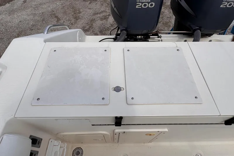 Slide: The Image of 2004 Pursuit 2670 Cuddy Console boat with dual Yamaha 200 engines. - 10