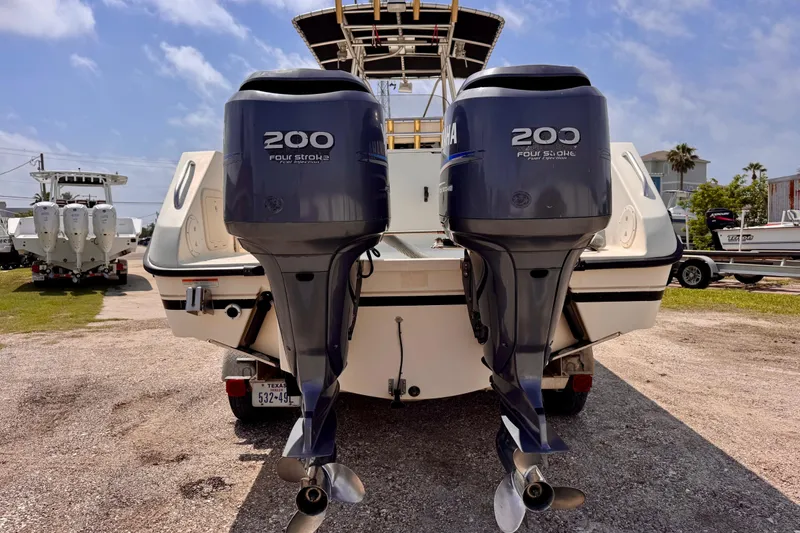 Slide: The Image of 2004 Pursuit 2670 Cuddy Console with twin Yamaha 200 four-stroke engines, rear view. - 3