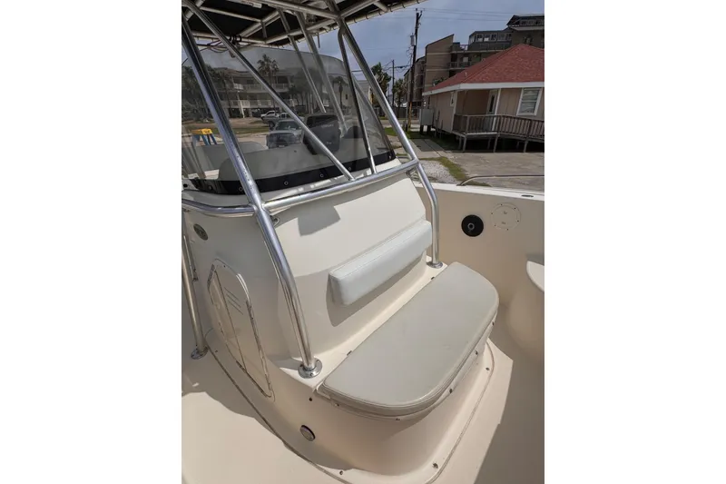 Slide: The Image of 2004 Pursuit 2670 Cuddy Console boat interior with seating and console view. - 39