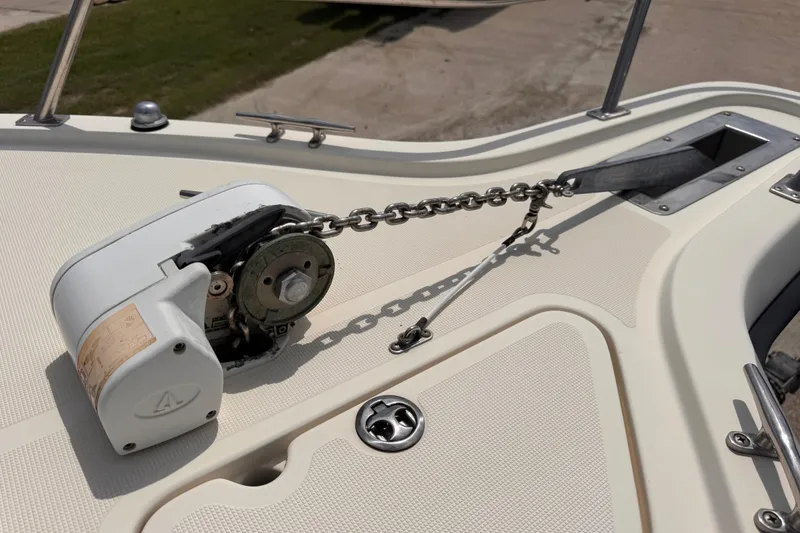 Slide: The Image of Anchor windlass on 2004 Pursuit 2670 Cuddy Console boat deck. - 50