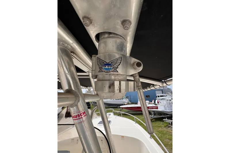 Slide: The Image of Close-up of a 2004 Pursuit 2670 Cuddy Console boat's metal structure and fittings. - 55