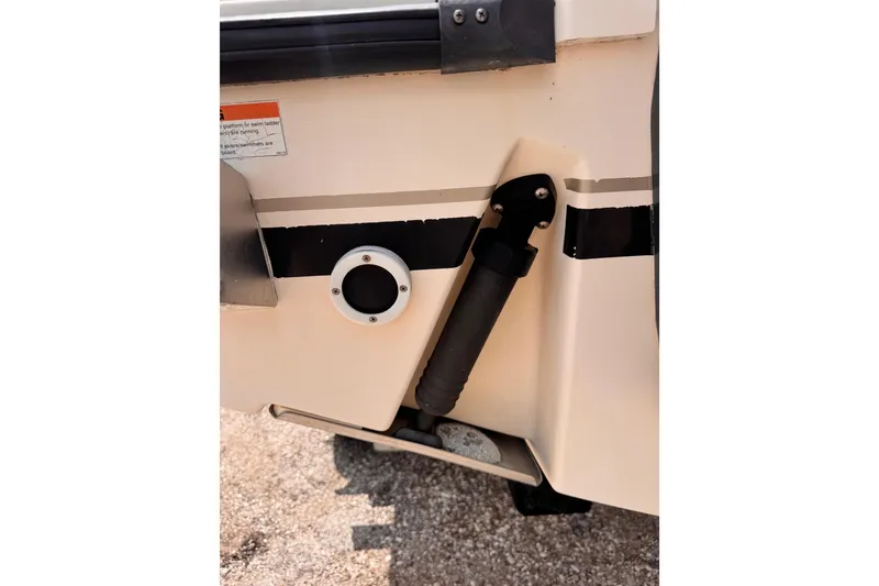 Slide: The Image of 2004 Pursuit 2670 Cuddy Console boat detail showing hull and fittings. - 56