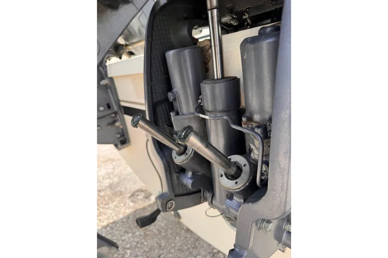 Slide: The Image of Close-up of 2004 Pursuit 2670 Cuddy Console boat engine components. - 60