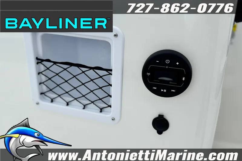 Slide: The Image of 2026 Bayliner Element E16 boat dashboard with Bluetooth controls and storage net. - 15
