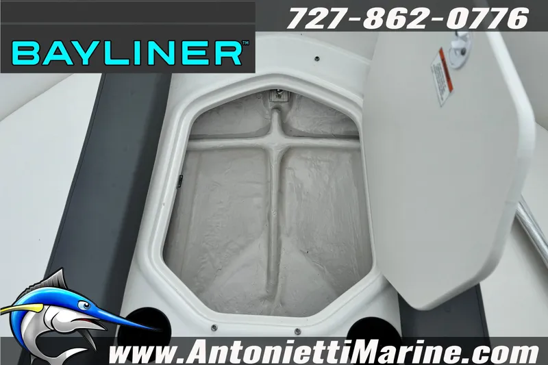 Slide: The Image of 2026 Bayliner Element E16 storage compartment open, showcasing interior space. - 17