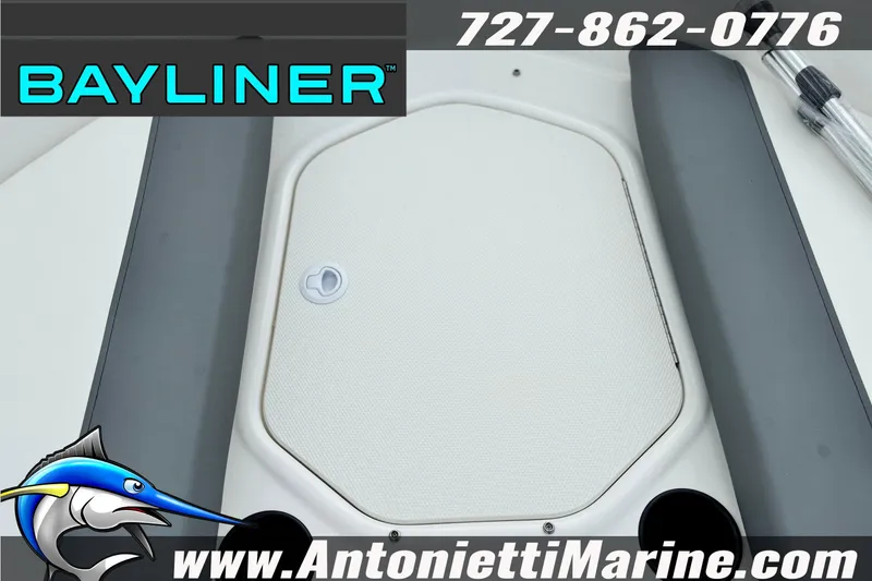 Slide: The Image of Bayliner Element E16 boat deck, 2026 model, featuring storage hatch and branding. - 16