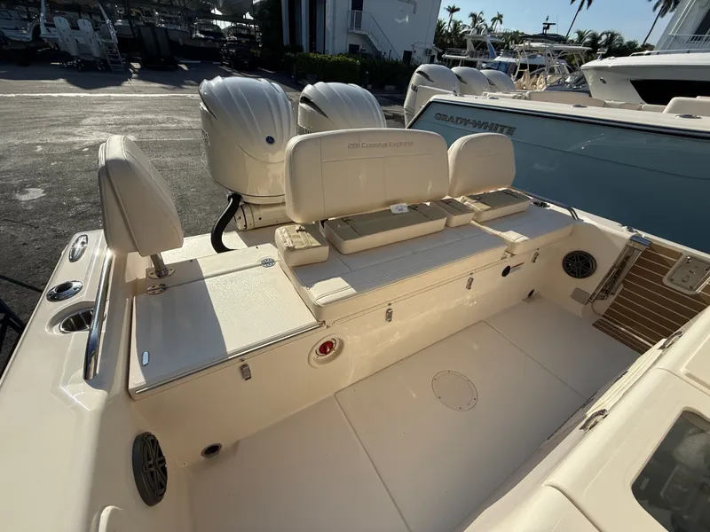 Slide: The Image of The image shows the stern of a Grady-White 281 Coastal Explorer boat with two engines. - 11