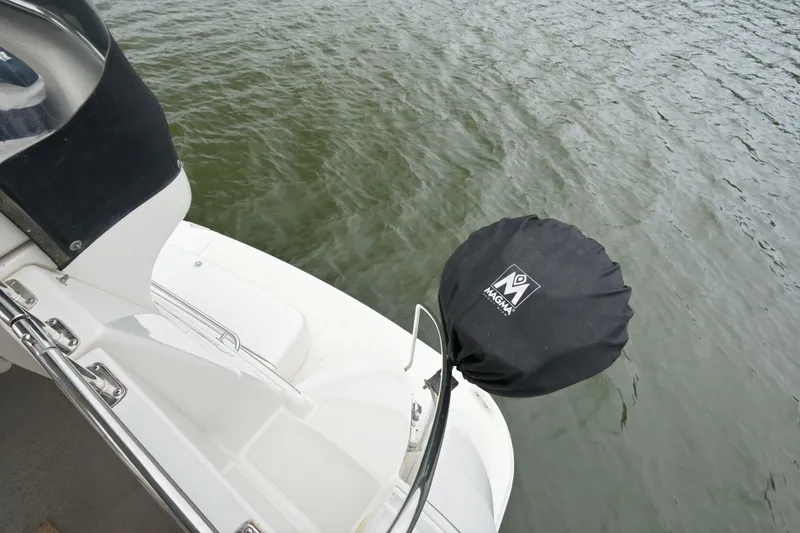 Slide: The Image of 2005 Carver 39 Motor Yacht deck with Magma grill cover, near water. - 11