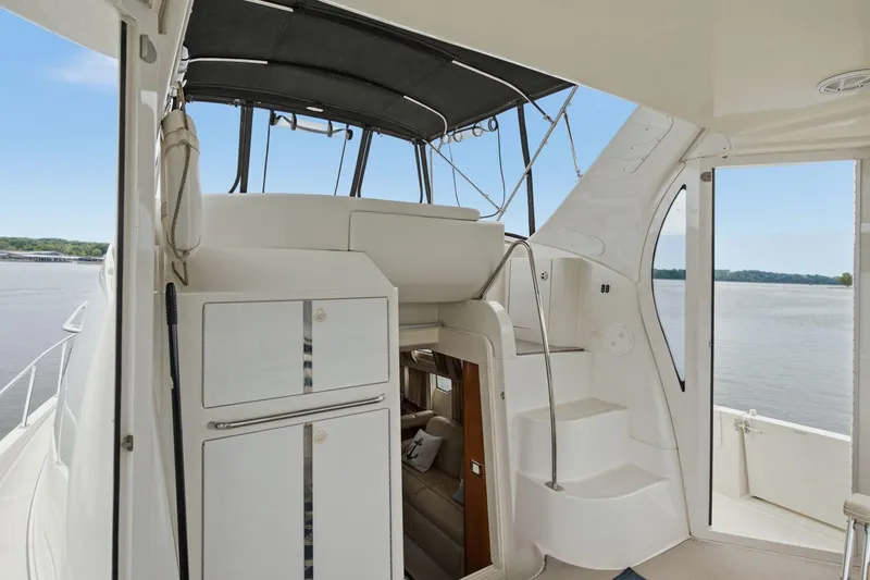 Slide: The Image of 2005 Carver 39 Motor Yacht interior with stairs and water view. - 14