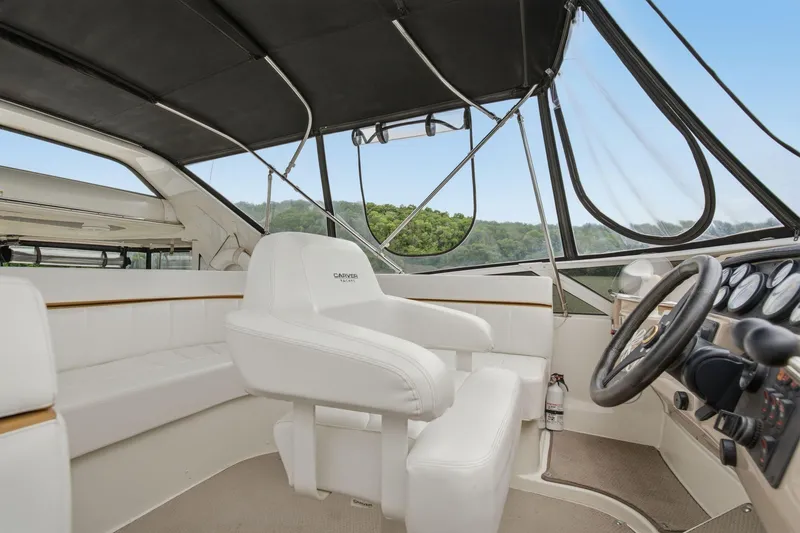 Slide: The Image of Interior of 2005 Carver 39 Motor Yacht with helm and seating area. - 17
