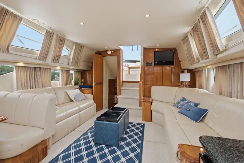 Slide: The Image of Luxurious interior of a 2005 Carver 39 Motor Yacht with plush seating and elegant decor. - 24
