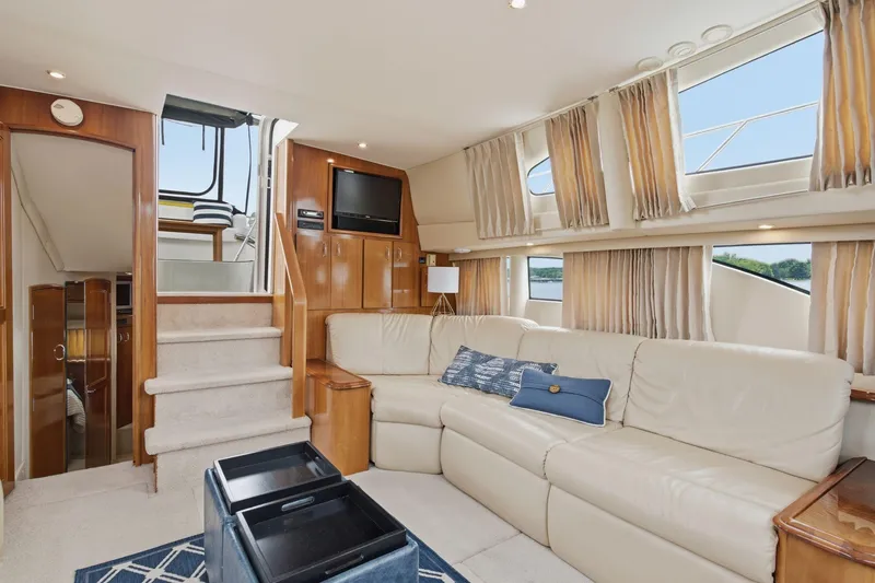 Slide: The Image of Luxurious interior of 2005 Carver 39 Motor Yacht with plush seating and elegant decor. - 25