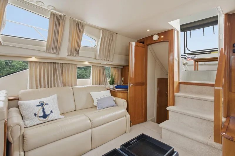 Slide: The Image of Interior of 2005 Carver 39 Motor Yacht with beige sofa and nautical decor. - 26
