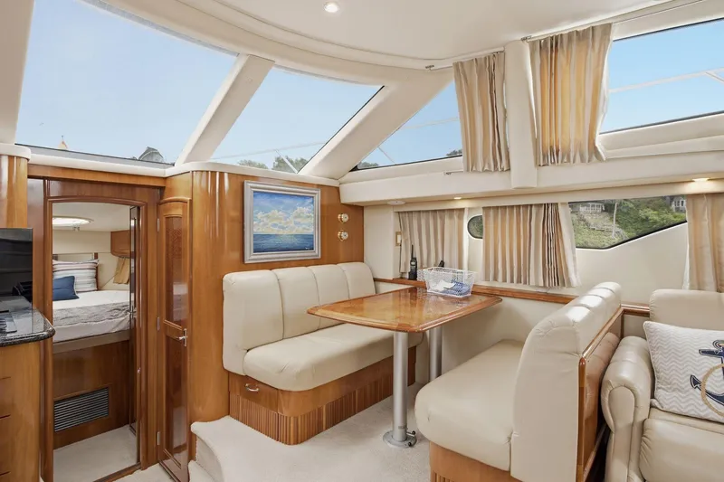 Slide: The Image of Luxurious interior of 2005 Carver 39 Motor Yacht with elegant seating and skylights. - 27