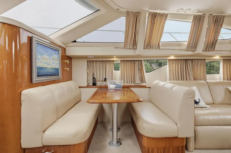 Slide: The Image of Luxurious interior of 2005 Carver 39 Motor Yacht with elegant seating and natural light. - 29