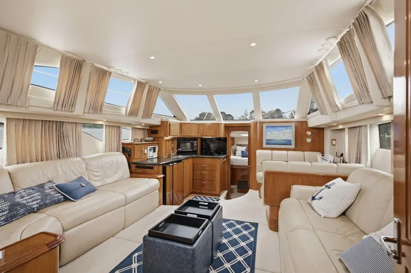 Slide: The Image of Luxurious interior of 2005 Carver 39 Motor Yacht with elegant furnishings and panoramic windows. - 31