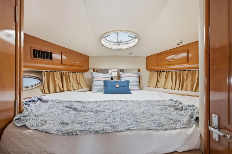 Slide: The Image of Luxurious bedroom interior of 2005 Carver 39 Motor Yacht with cozy bedding. - 32