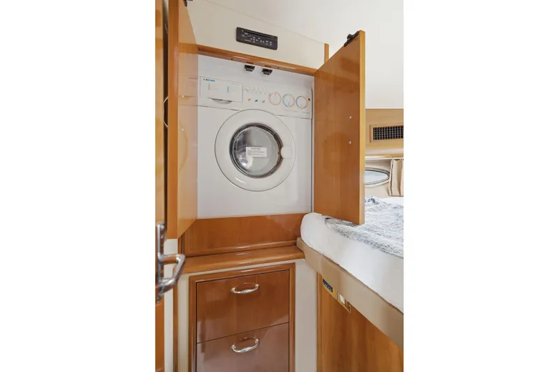 Slide: The Image of Laundry area inside 2005 Carver 39 Motor Yacht with washer and storage cabinets. - 35