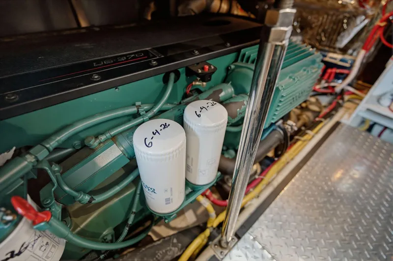 Slide: The Image of Engine room of 2005 Carver 39 Motor Yacht with visible filters and wiring. - 46