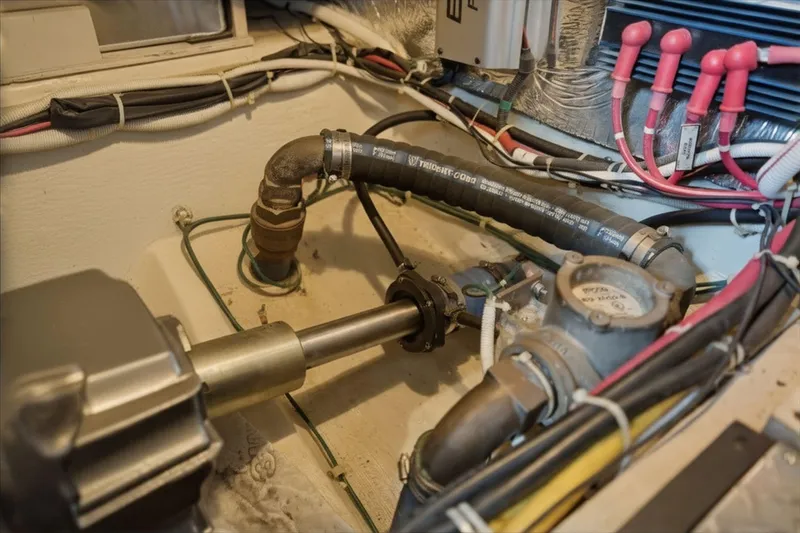 Slide: The Image of Engine room of 2005 Carver 39 Motor Yacht showing mechanical components and wiring. - 48