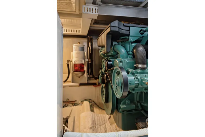Slide: The Image of Engine room of 2005 Carver 39 Motor Yacht showcasing mechanical components. - 51