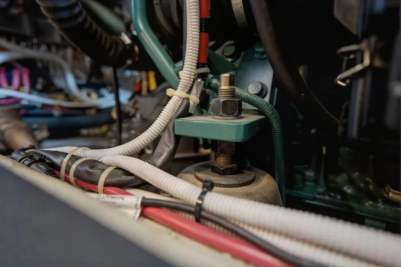Slide: The Image of Engine compartment of a 2005 Carver 39 Motor Yacht with visible wiring and components. - 57