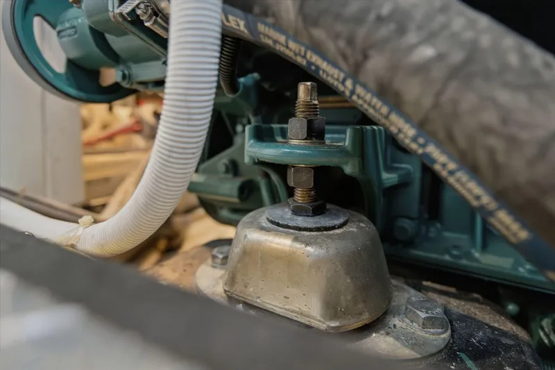Slide: The Image of Close-up of a 2005 Carver 39 Motor Yacht engine component with hoses and bolts. - 58