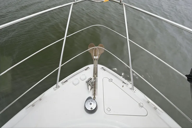 Slide: The Image of Bow view of 2005 Carver 39 Motor Yacht on calm water. - 8