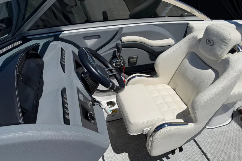 Slide: The Image of Interior of a 2020 Cobalt R3 boat featuring a sleek steering console and plush seating. - 14