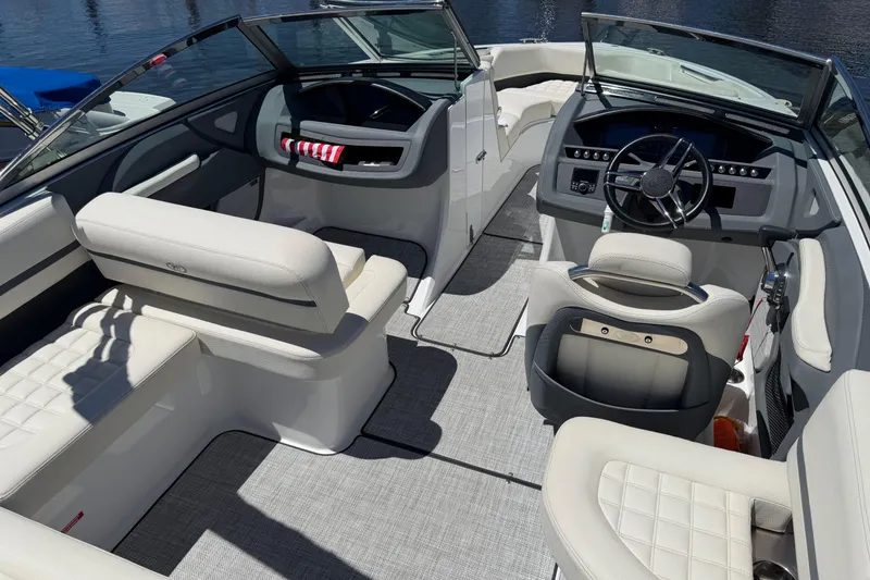 Slide: The Image of Interior of a 2020 Cobalt R3 boat with luxurious seating and modern dashboard. - 15