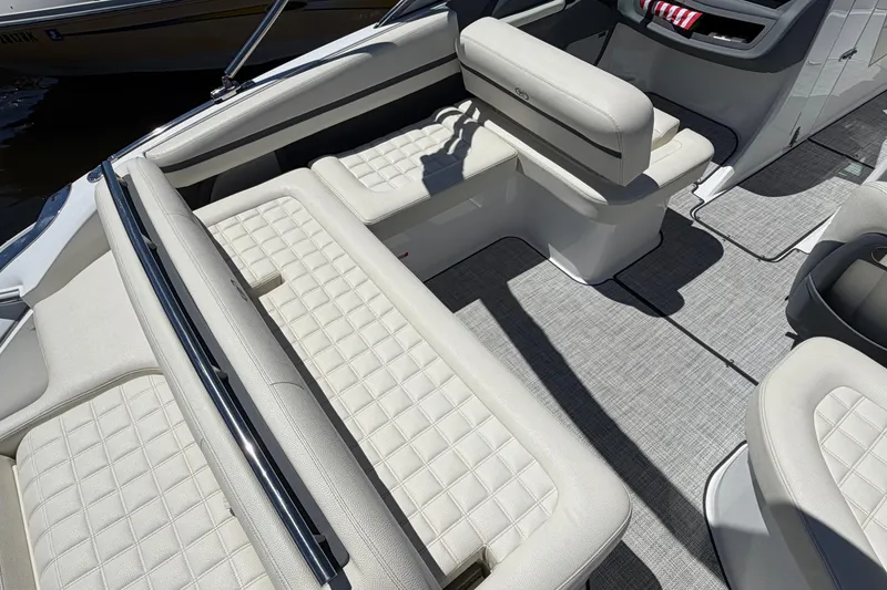Slide: The Image of 2020 Cobalt R3 boat interior with white quilted seating and gray flooring. - 16