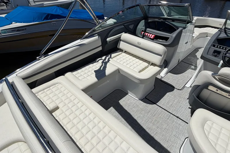 Slide: The Image of 2020 Cobalt R3 boat interior with luxurious white seating and modern dashboard. - 17